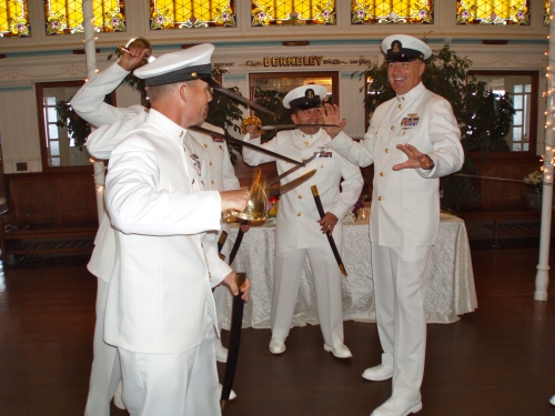 The groomsmen in Navy uniform practiced their sword arch and chatted with